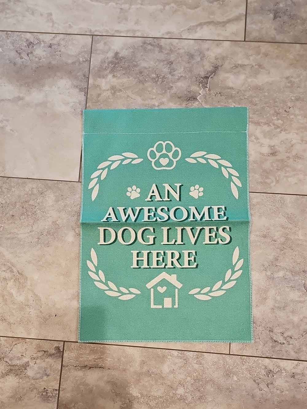 Teal "An Awesome Dog Lives Here" Garden Flag.
